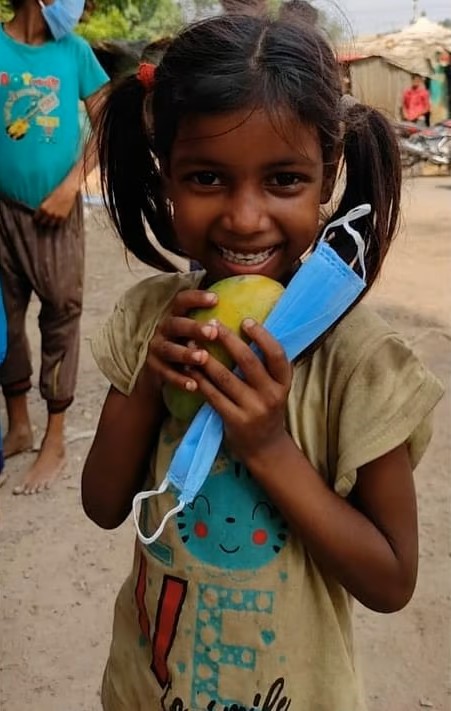 Child smiling after receiving support